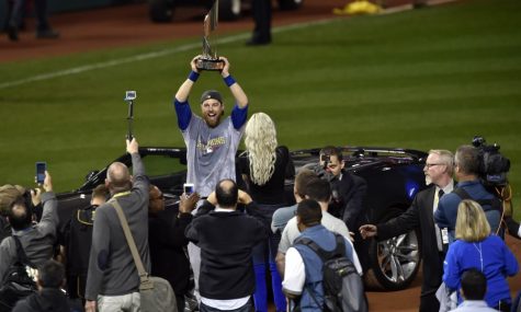 (Houston Chronicle) Ben Zobrist lifts high the 2016 MVP trophy. 