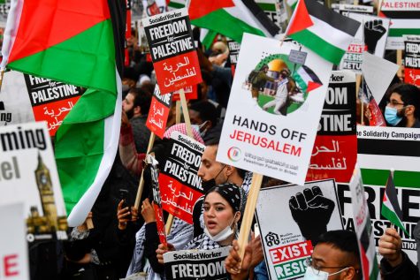 Pro-Palestinian demonstrators attend a protest following a flare-up of Israeli-Palestinian violence, in London, Britain May 11, 2021. REUTERS/Toby Melville