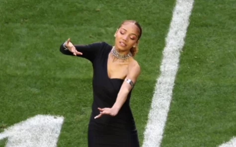 Justina Miles at the Super Bowl LVII performing Lift Every Voice and Sing in ASL.